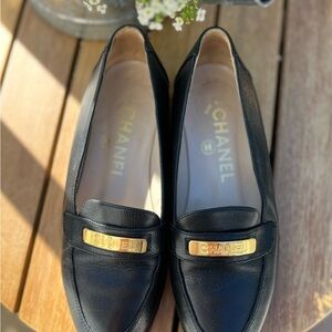 CHANEL Black and Gold Loafers with Elegant Design